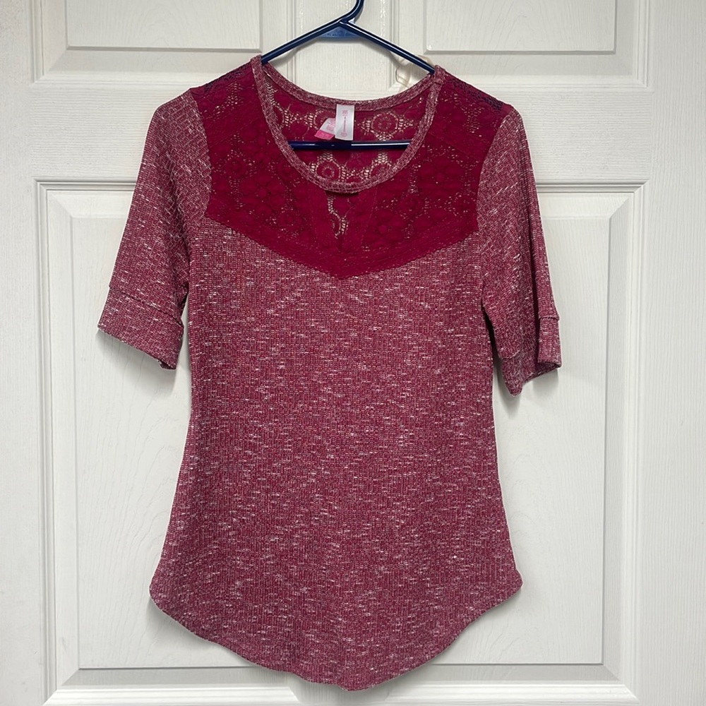 Women’s top size XL but looks like a large